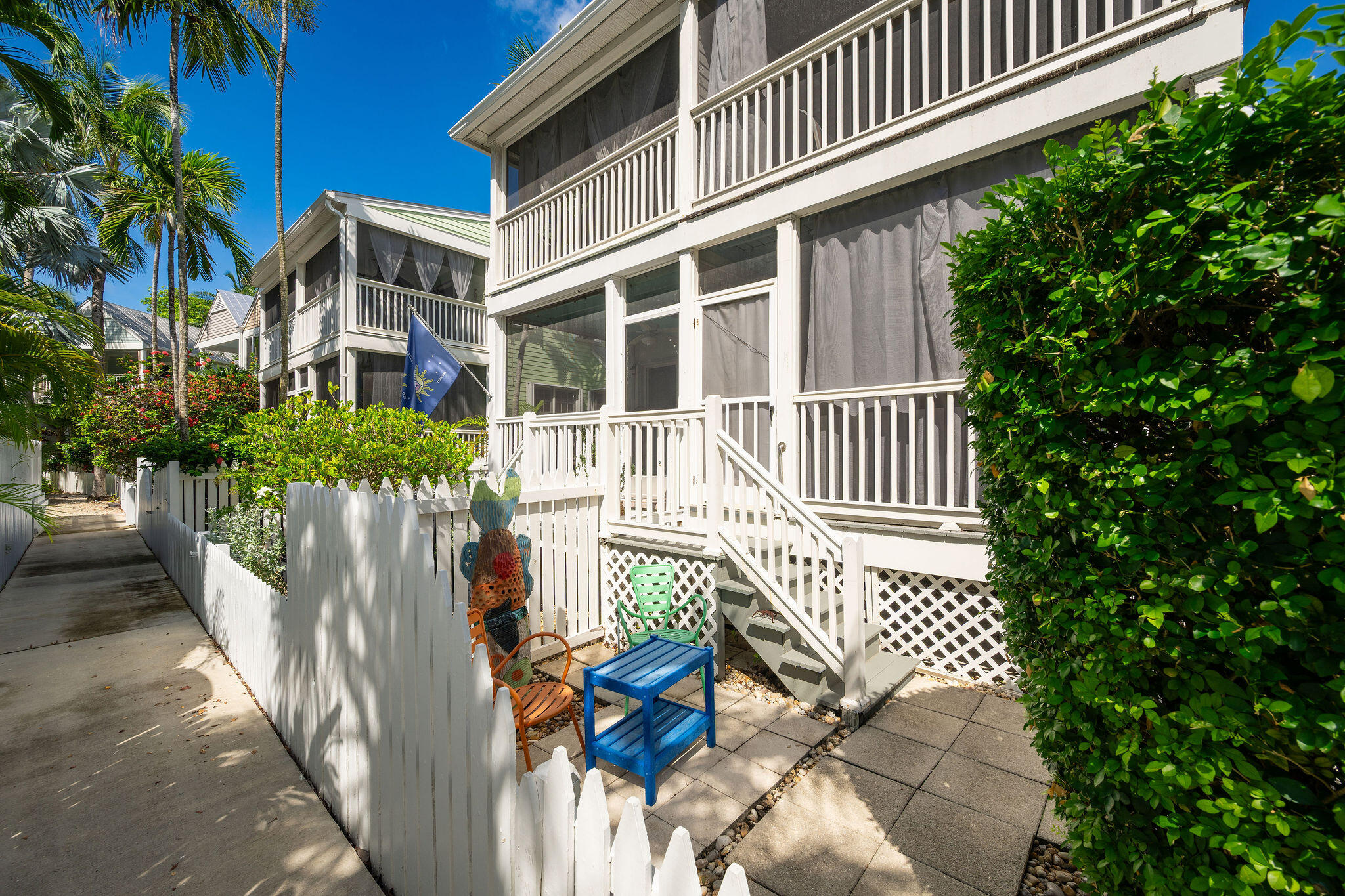 1 Spoonbill Way Key West, FL 33040 - Photo 22 of 38 a view of outdoor chair and table of the house