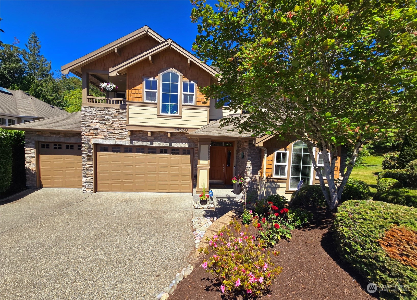16520 Southeast 165th Way Renton, WA 98058 - Photo 1 of 35 a front view of a house with a yard and garage