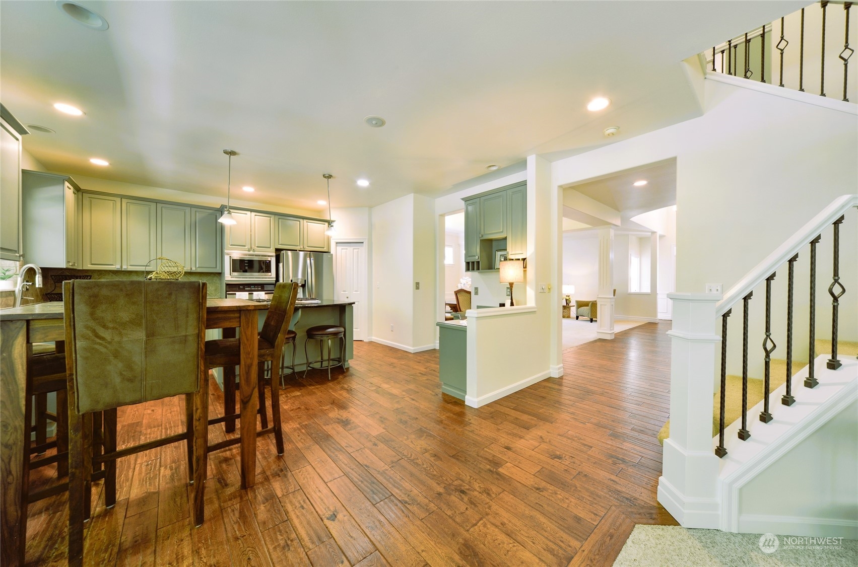 16520 Southeast 165th Way Renton, WA 98058 - Photo 14 of 35 a view of kitchen and dining room with wooden floor