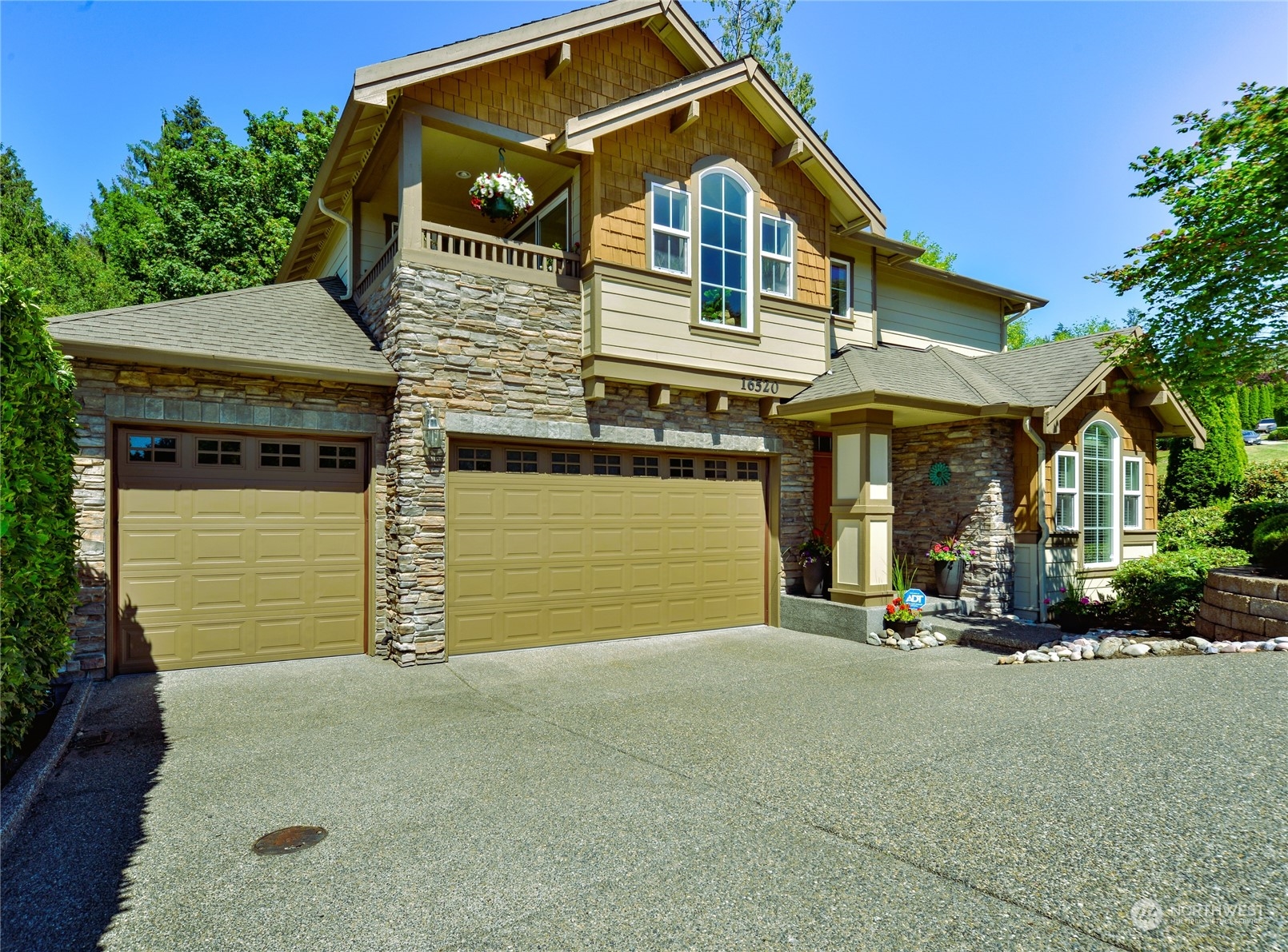 16520 Southeast 165th Way Renton, WA 98058 - Photo 2 of 35 a front view of a house with a garage
