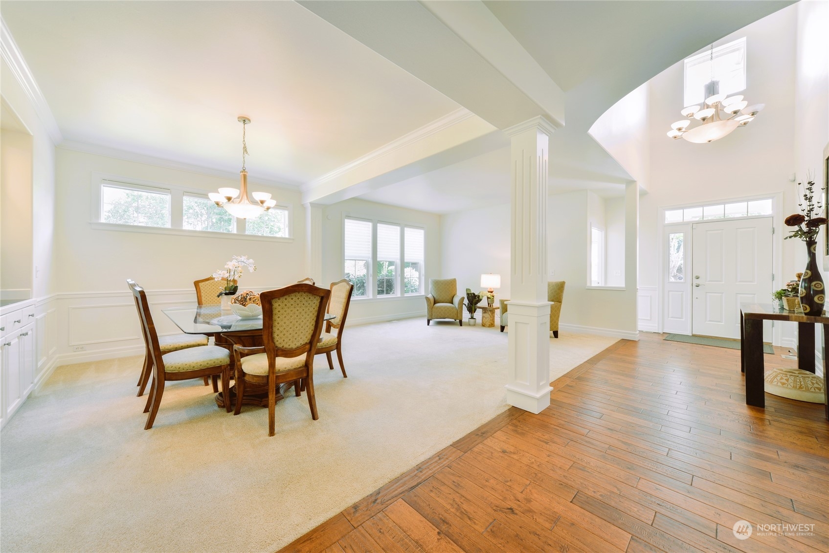 16520 Southeast 165th Way Renton, WA 98058 - Photo 7 of 35 a view of a dining room with furniture a chandelier and wooden floor