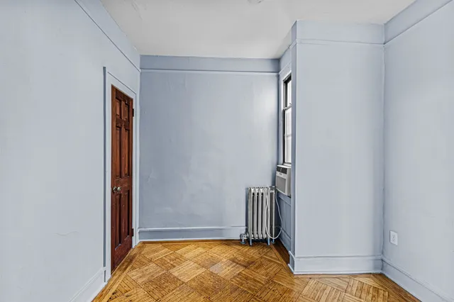 a view of front door with wooden floor