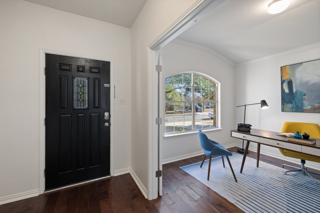 218 Calline Mayes Run Buda, TX 78610 - Photo 2 of 27 a workspace with wooden floor and a window