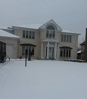 a view of a house with a yard and garage