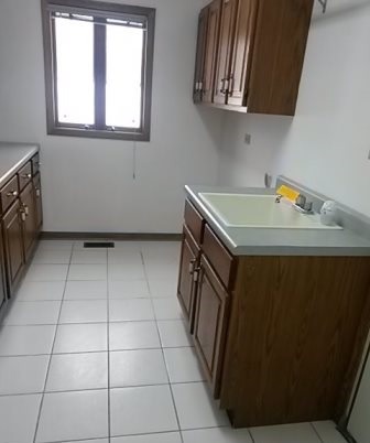 20206 Mohawk Trail Olympia Fields, IL 60461 - Photo 14 of 15 a utility room with cabinets