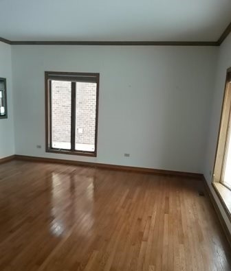 20206 Mohawk Trail Olympia Fields, IL 60461 - Photo 9 of 15 an empty room with wooden floor and windows