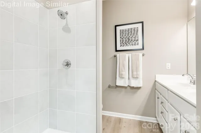 a bathroom with a shower and a sink