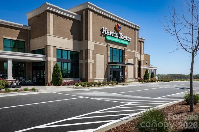 a view of a back yard of a house with a yard