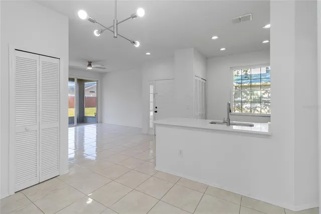 a view of an empty room with glass door