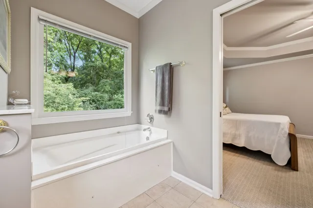 a en suite bathroom with a tub and sink