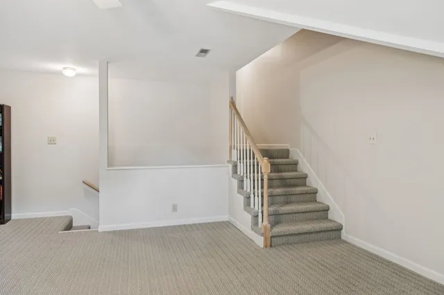 a front view of house with yard and trees