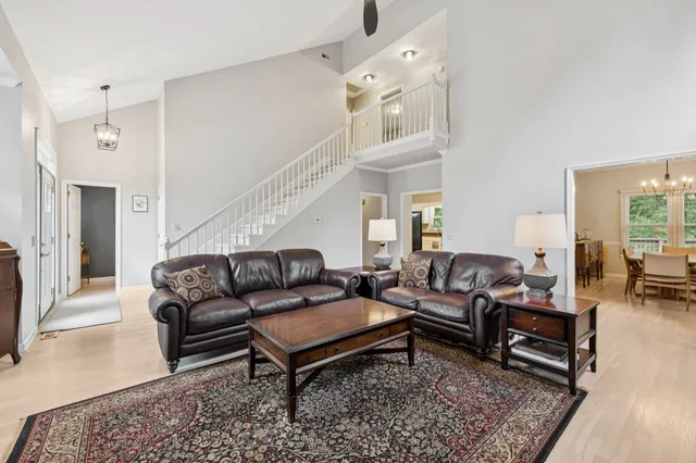 a living room with furniture and a rug