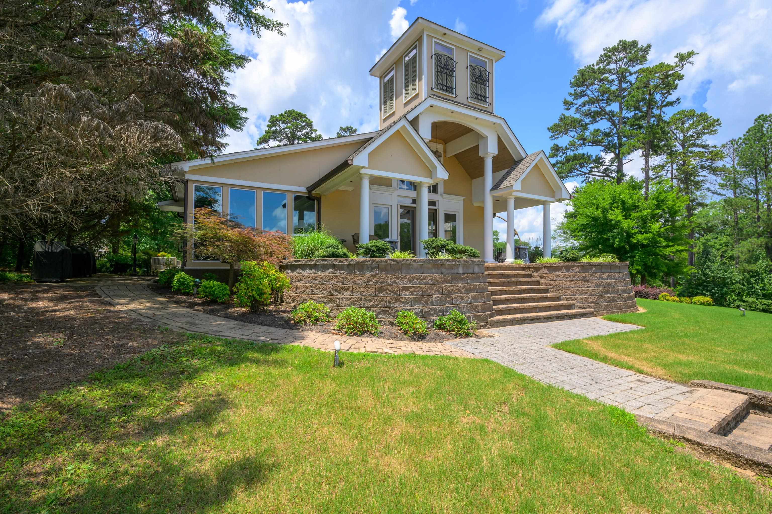 a front view of a house with garden