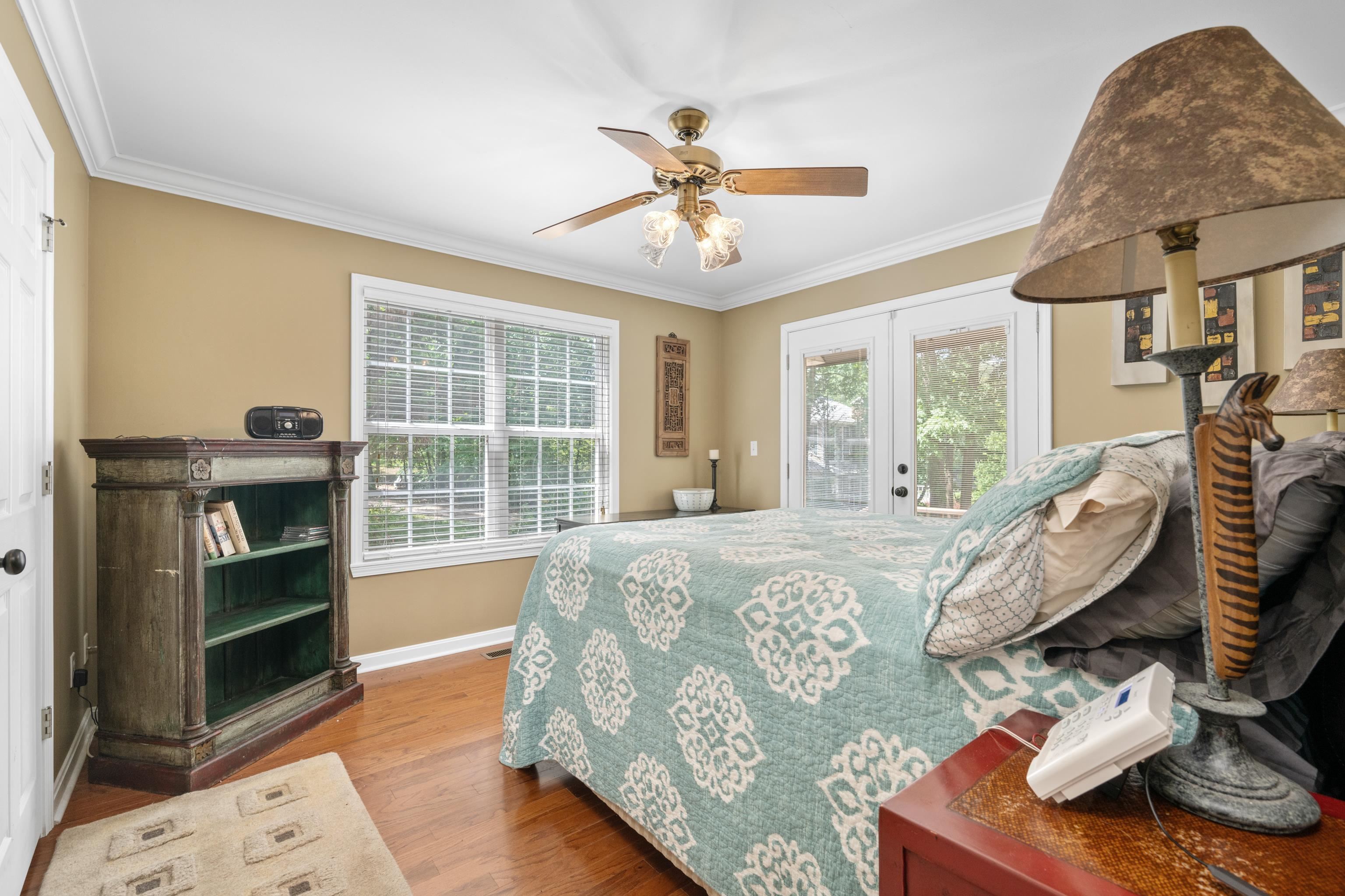 685 River Cliff Lane Counce, TN 38326 - Photo 21 of 39 a bed sitting in a bedroom next to a window