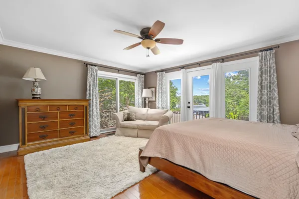 a bed room with a bed and a window