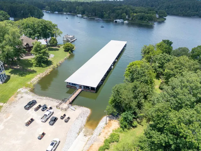 an aerial view of a house with a lake view