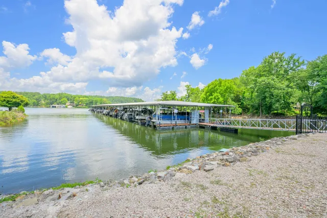 a view of a lake with a house in the background