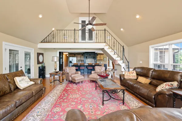 a living room with furniture or couch and a dining table