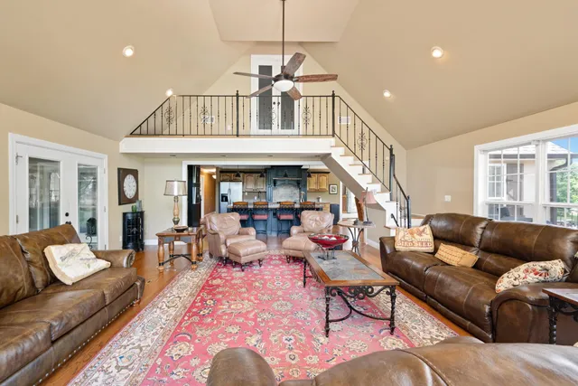 a living room with furniture or couch and a dining table