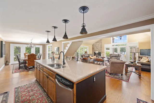 a very nice looking living room with dining room and wooden floor