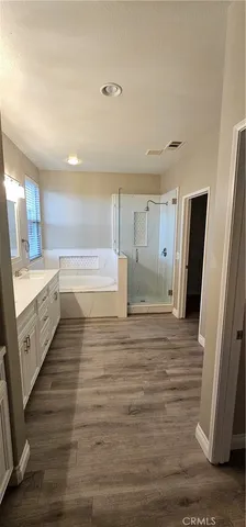 a view of a kitchen cabinets and wooden floor