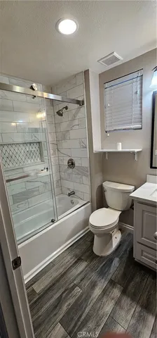 a bathroom with a toilet a sink and a bathtub