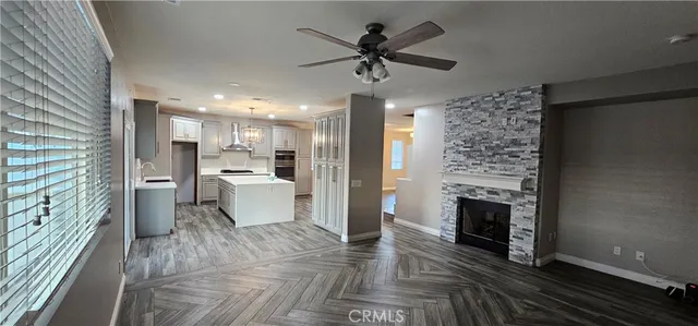 a view of a kitchen with a stove cabinets and a fireplace