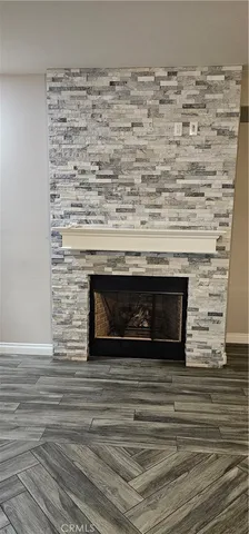 a close view of a fireplace in an empty room