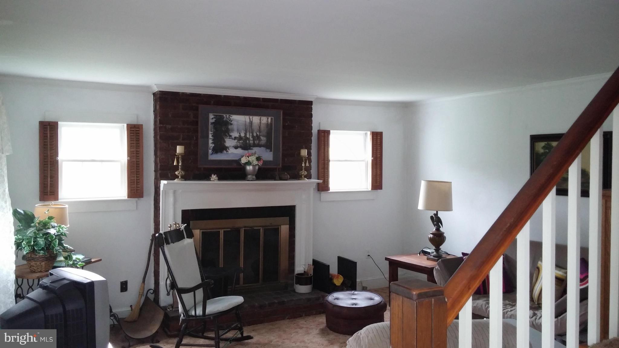 31440 Old Plank Road Locust Grove, VA 22508 - Photo 6 of 30 Living Room has wood burning fireplace