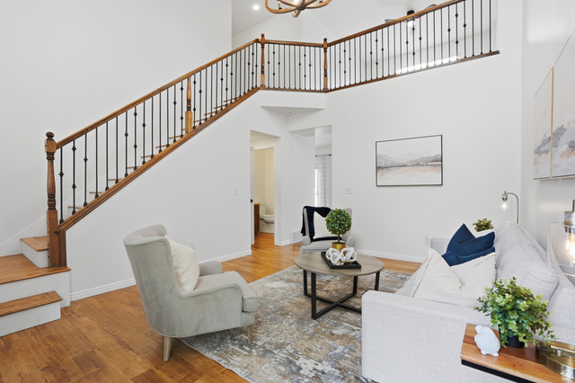 2007 Fielding Hill Lane Draper, UT 84020 - Photo 8 of 83 Two-story foyer with wood-finish flooring and a staircase featuring a wood handrail with wrought iron balusters