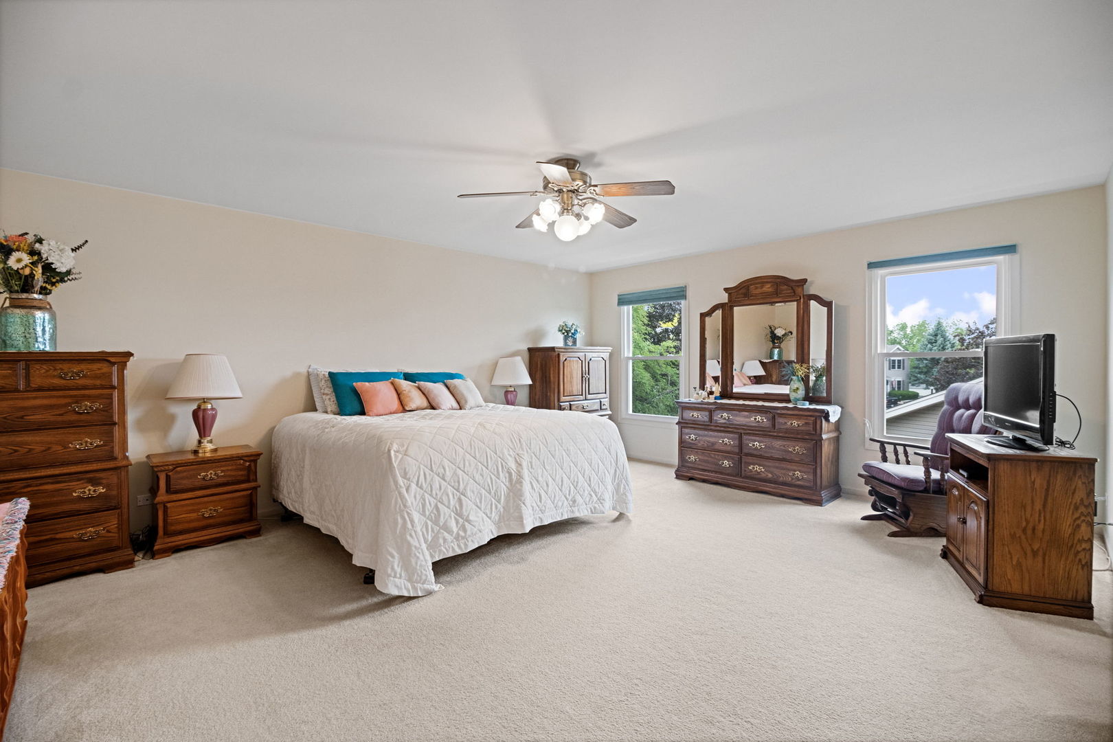 145 Barnes Road Elgin, IL 60124 - Photo 18 of 45 a bedroom with furniture and a flat screen tv