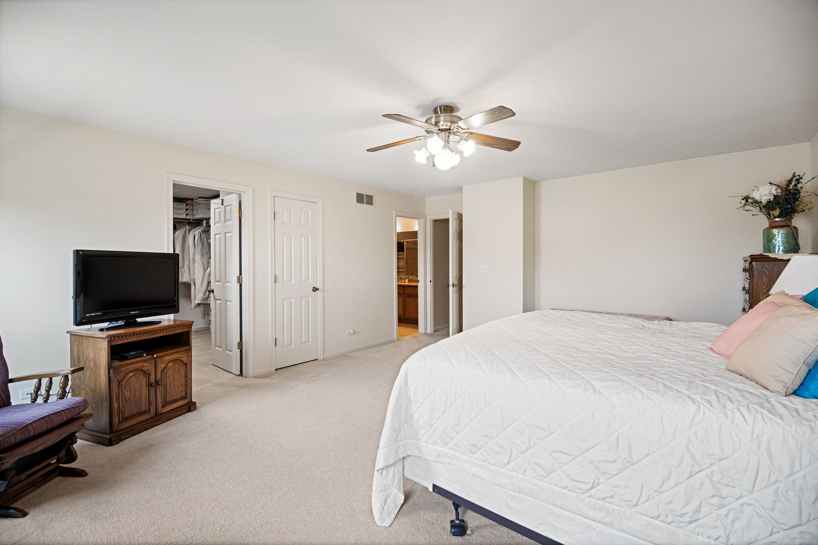 145 Barnes Road Elgin, IL 60124 - Photo 19 of 45 a bedroom with a bed and a flat screen tv