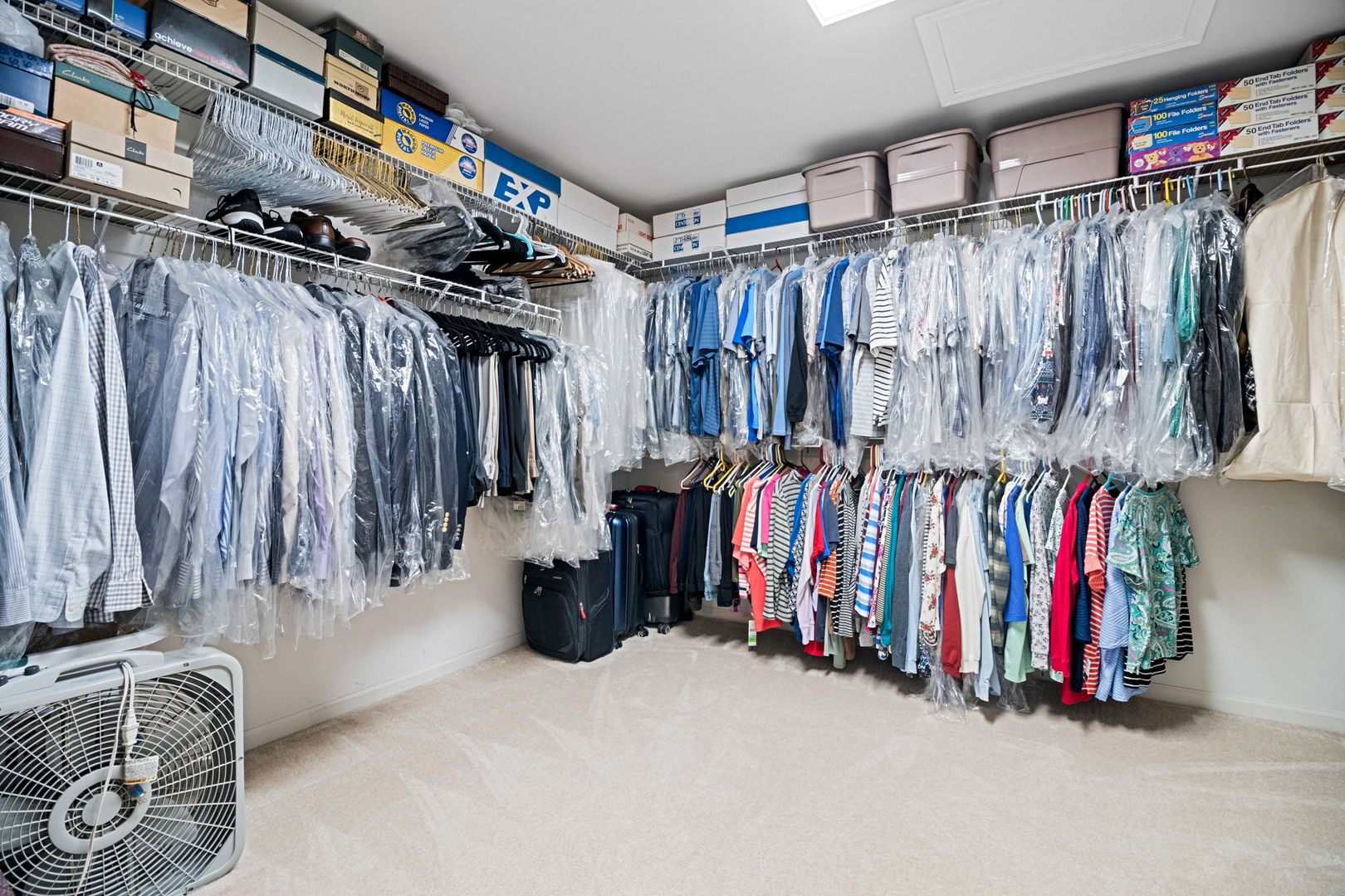 145 Barnes Road Elgin, IL 60124 - Photo 20 of 45 a view of walk in closet with clothes