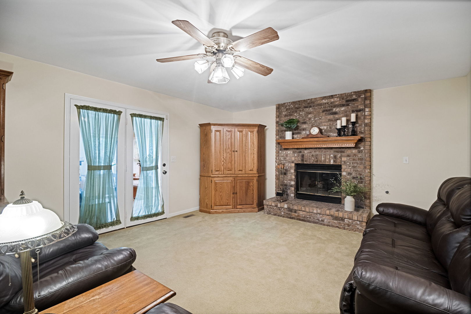 145 Barnes Road Elgin, IL 60124 - Photo 21 of 45 a living room with furniture and a fireplace