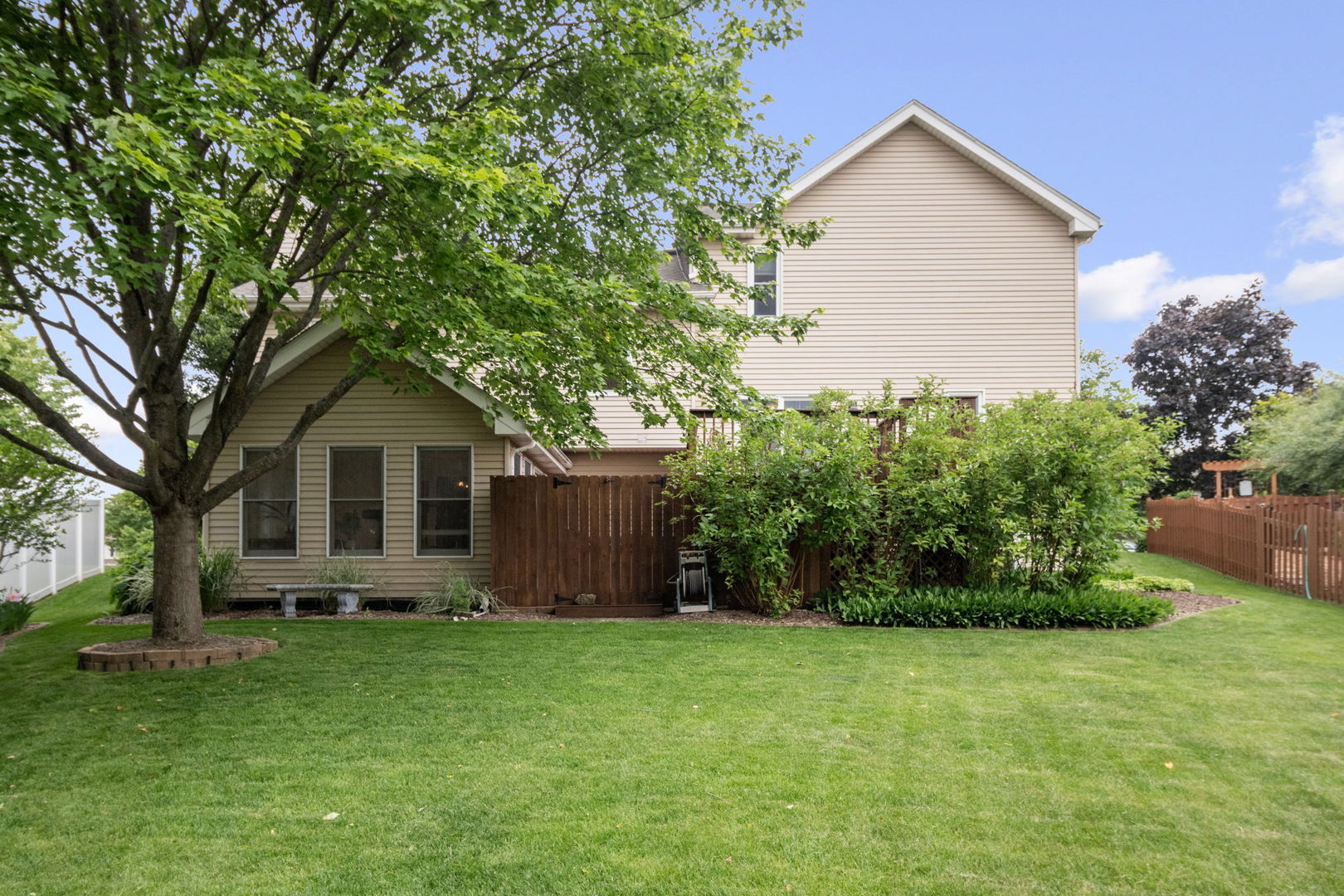 145 Barnes Road Elgin, IL 60124 - Photo 37 of 45 a front view of house with a garden