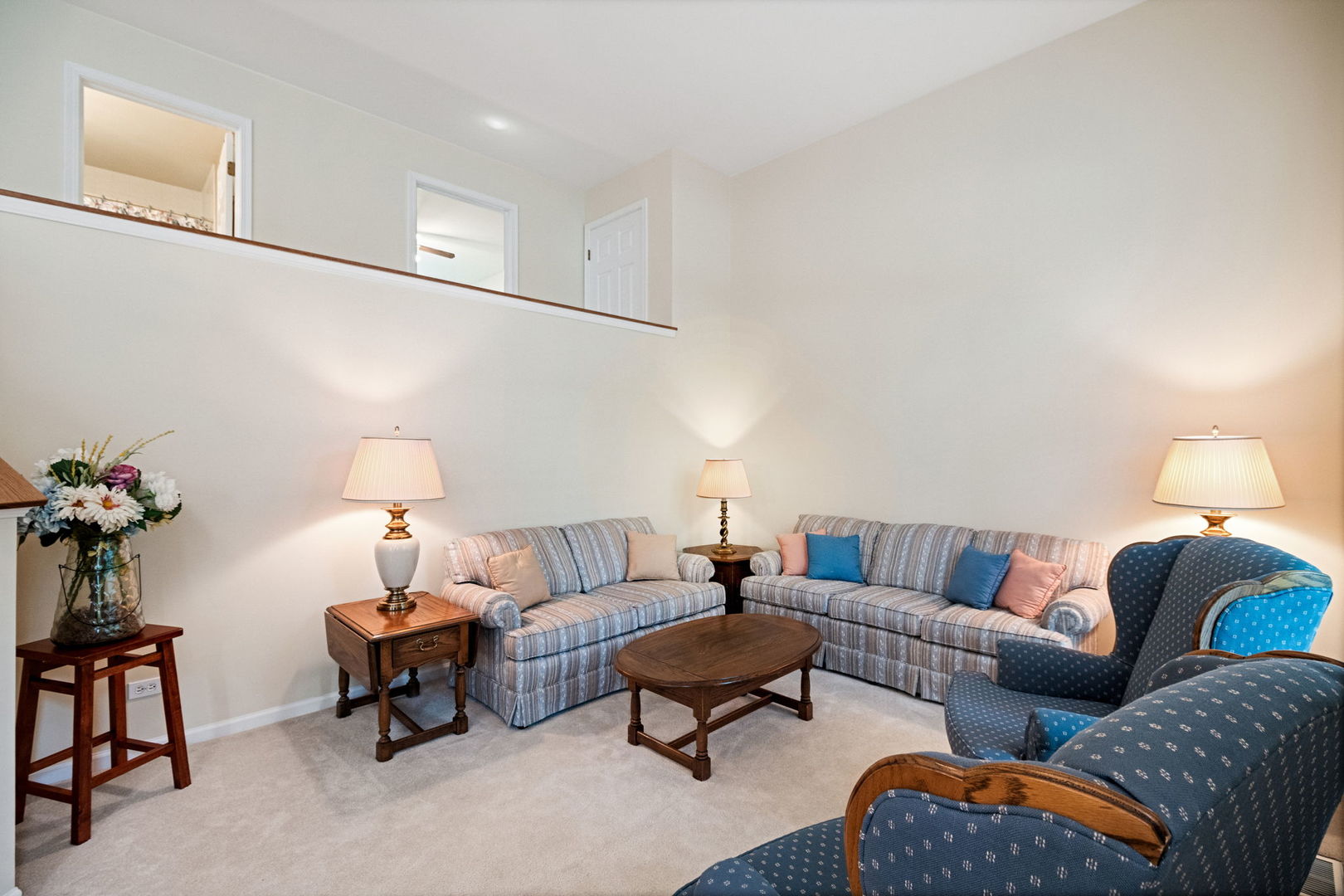 145 Barnes Road Elgin, IL 60124 - Photo 9 of 45 a living room with furniture potted plant and a lamp
