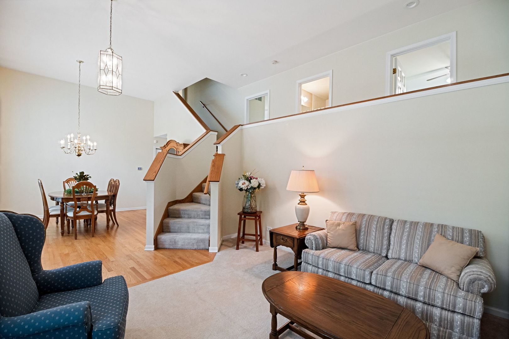 145 Barnes Road Elgin, IL 60124 - Photo 10 of 45 a living room with furniture and a chandelier