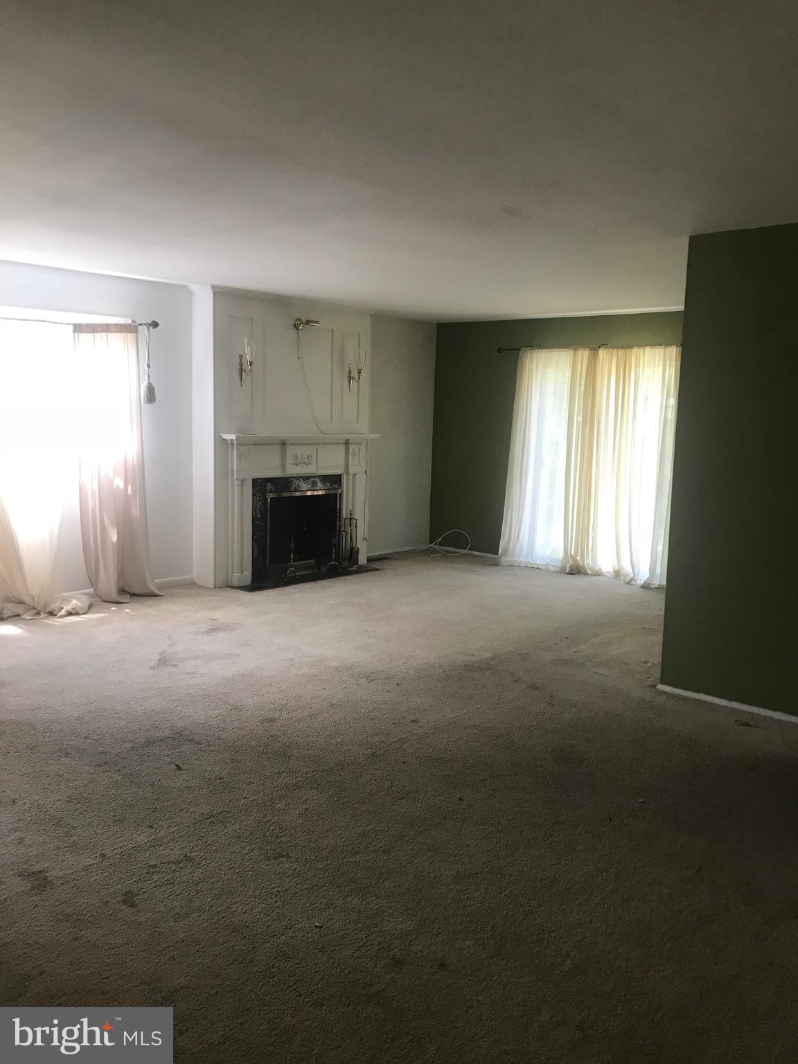 2028 Rolling Rd. Baltimore, MD 21244 - Photo 4 of 5 a view of empty room with a fireplace