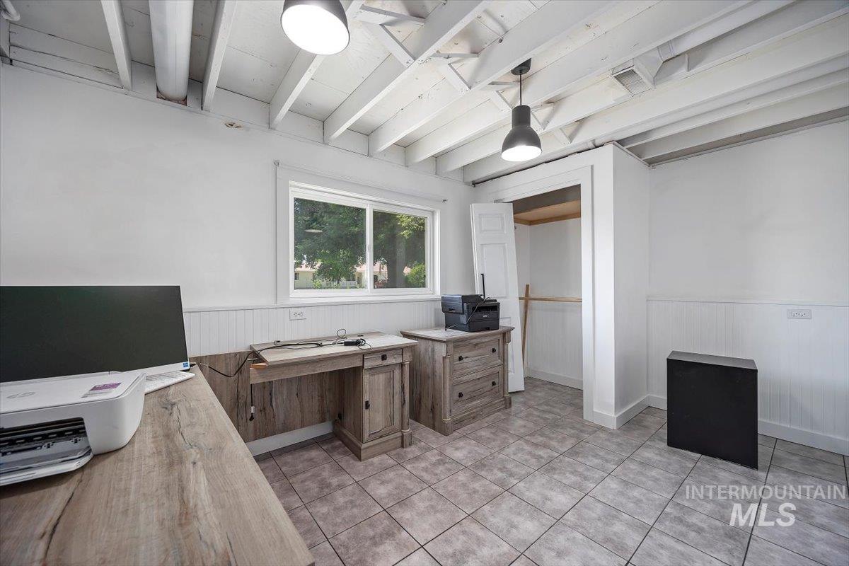 616 Doris Avenue Paul, ID 83347 - Photo 26 of 38 Office area with wainscoting, beamed ceiling, and light tile patterned floors