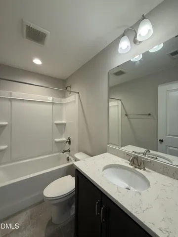 a bathroom with a shower and a toilet