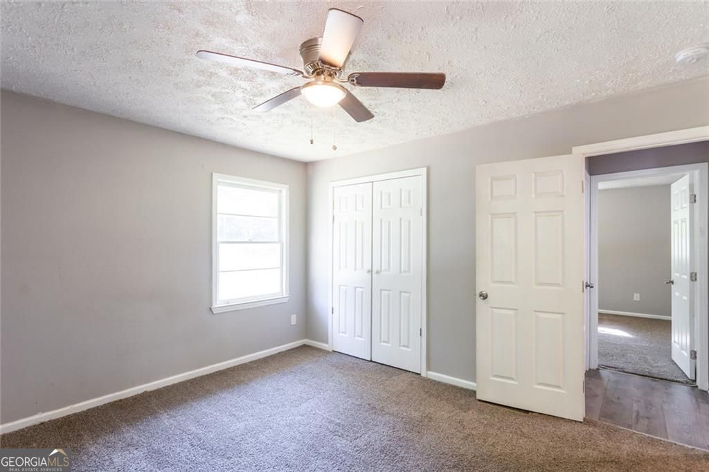 908 East Marable Street Monroe, GA 30656 - Photo 19 of 26 a view of an empty room with a window