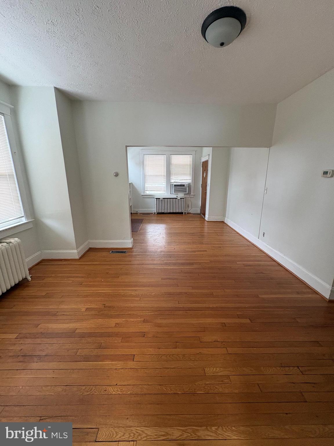 523 24th Street South Arlington, VA 22202 - Photo 3 of 18 a view of empty room with wooden floor