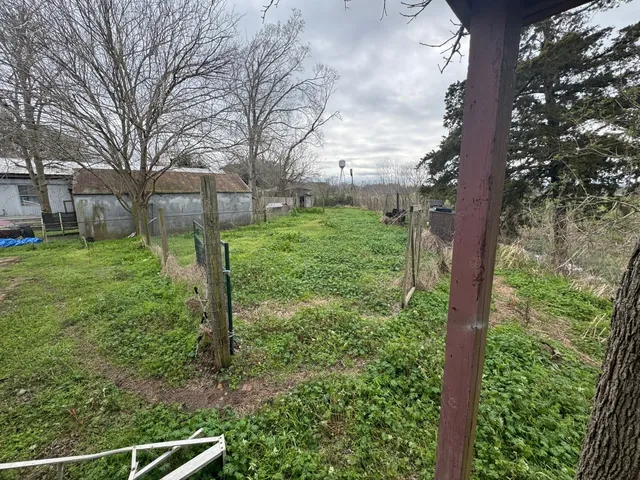 a view of a backyard of the house