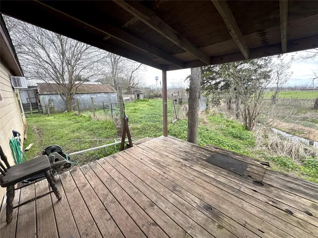 a front view of a house with a yard table and chairs