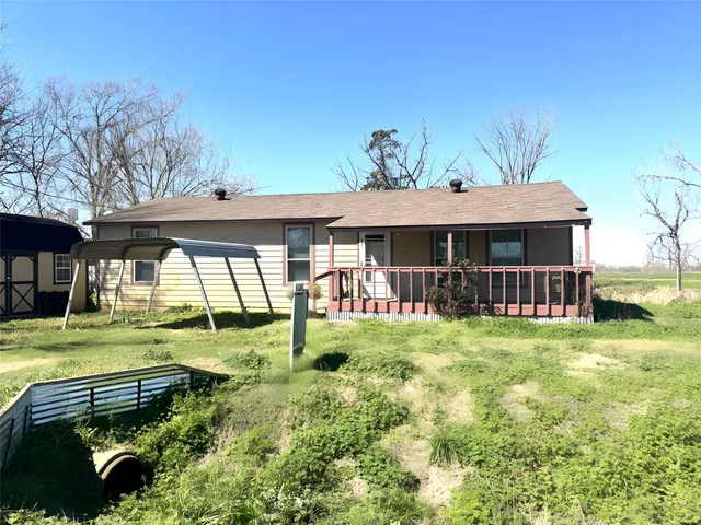 a backyard of a house with wooden fence