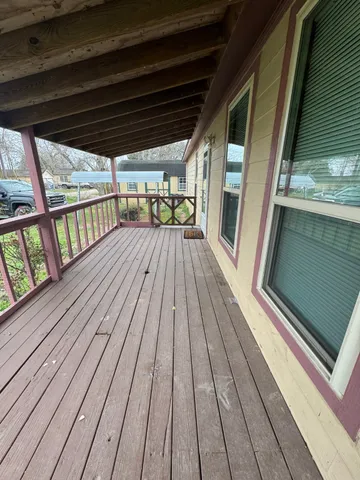 a view of outdoor space with wooden floor