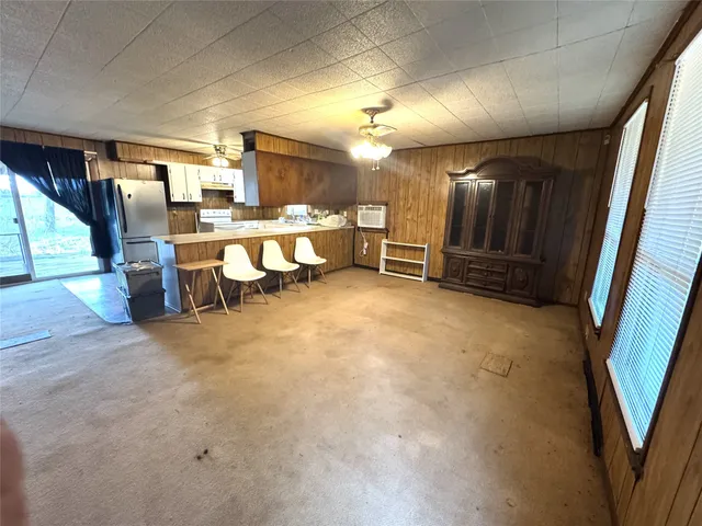 a view of an empty room with a fireplace