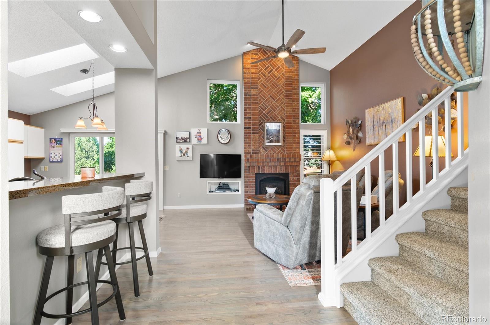 9836 Buckingham Court Highlands Ranch, CO 80130 - Photo 12 of 42 a view of entryway and hall with wooden floor
