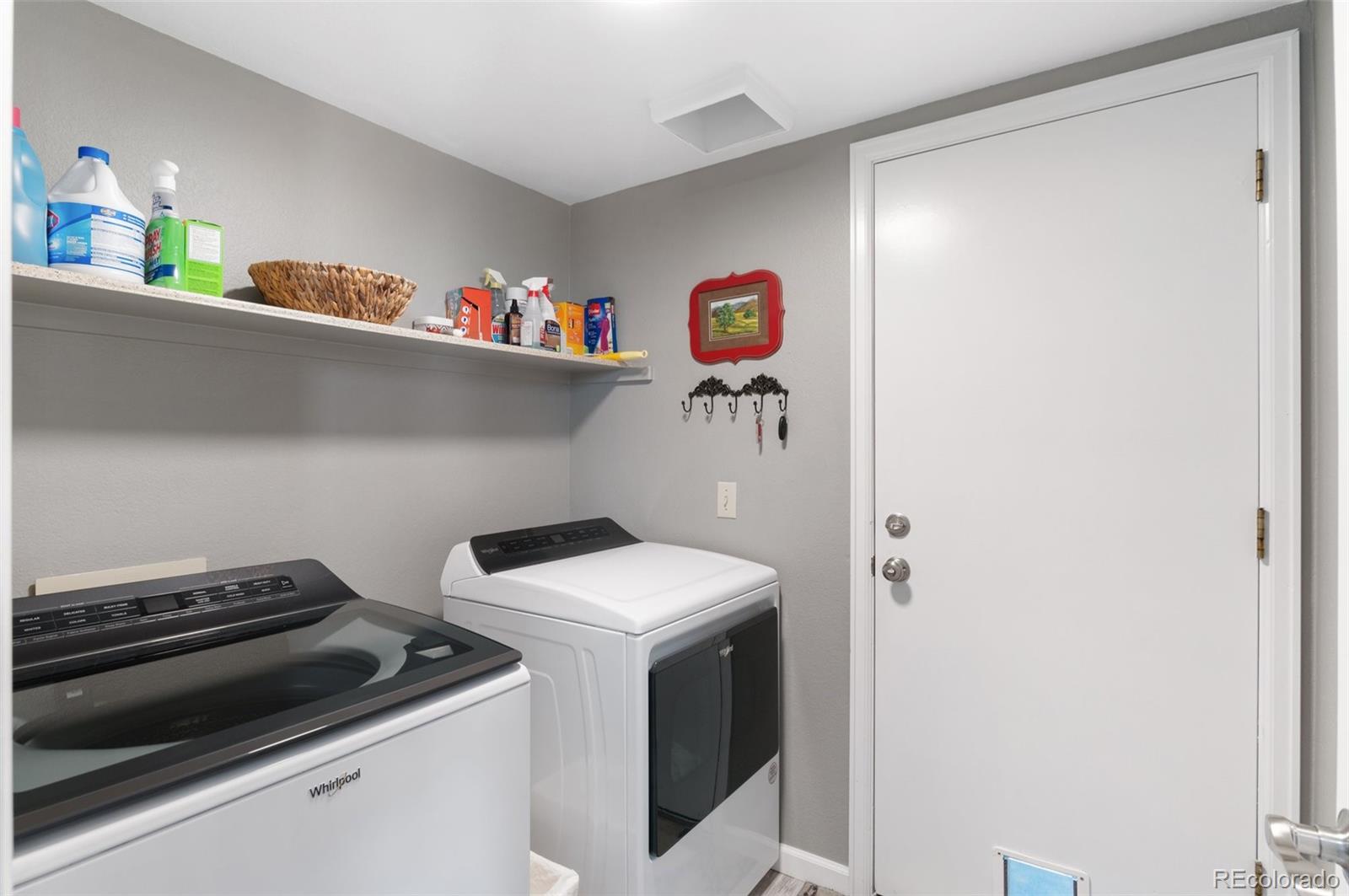 9836 Buckingham Court Highlands Ranch, CO 80130 - Photo 24 of 42 a utility room with dryer and washer