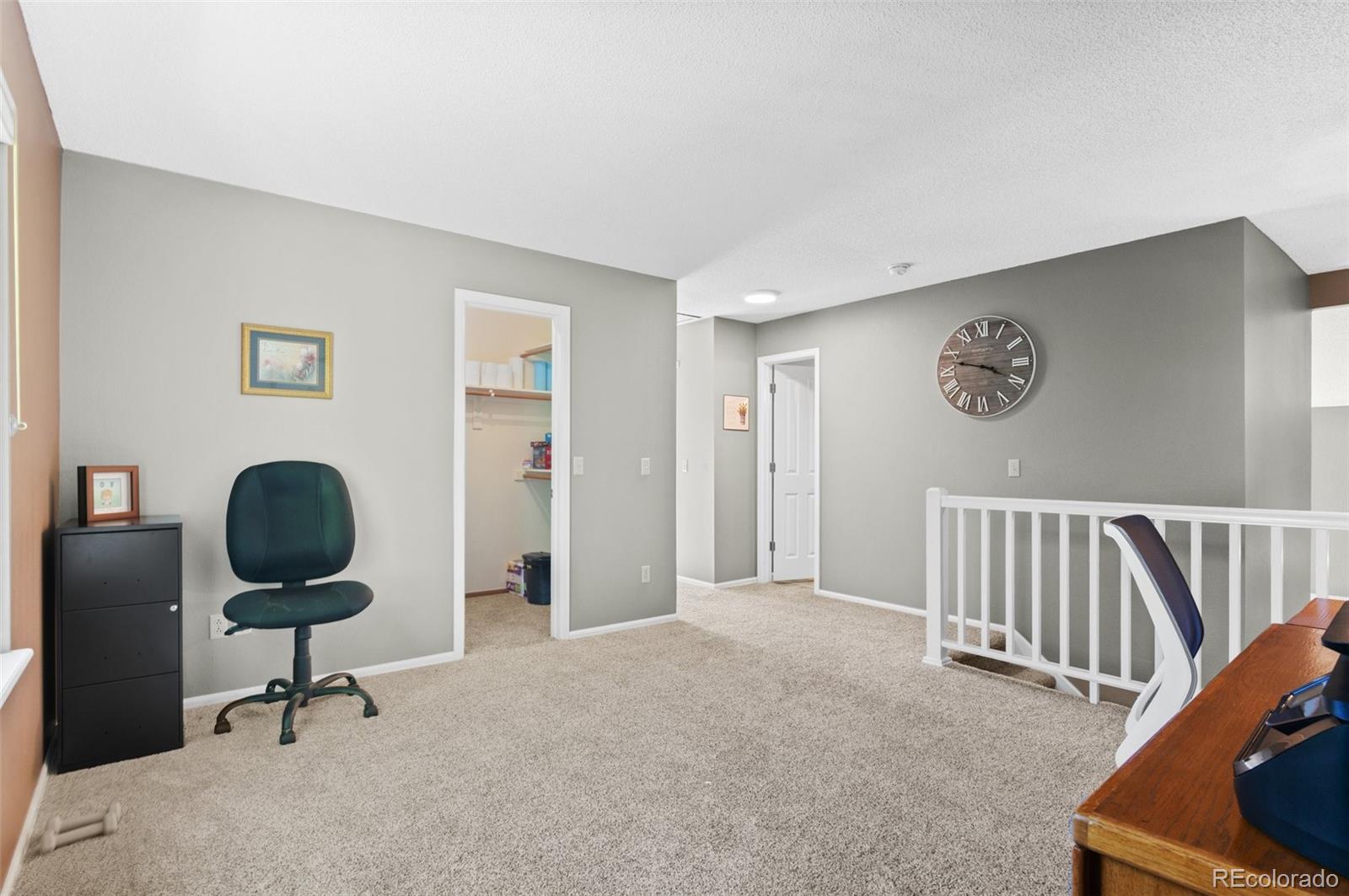 9836 Buckingham Court Highlands Ranch, CO 80130 - Photo 32 of 42 a living room with furniture